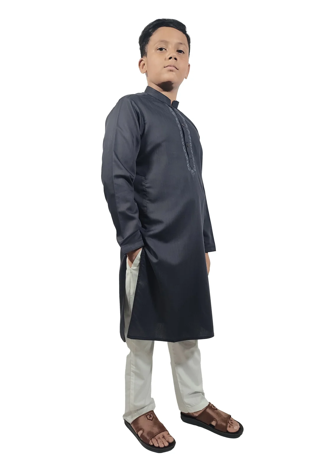 Boy wearing Rai Ahmed graphite grey kurta with embroidery and white trouser.